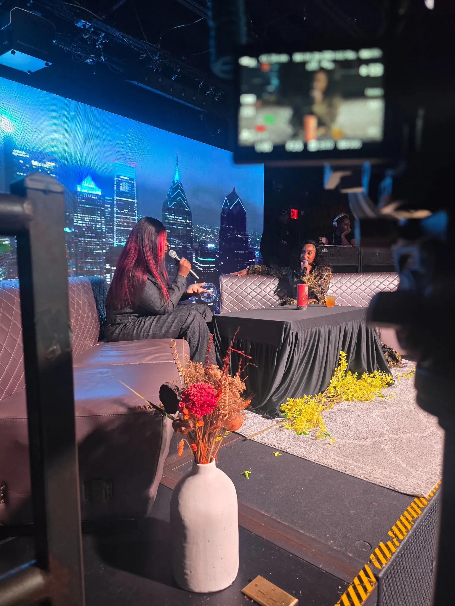 Behind the scenes interview set with camera framing the speakers