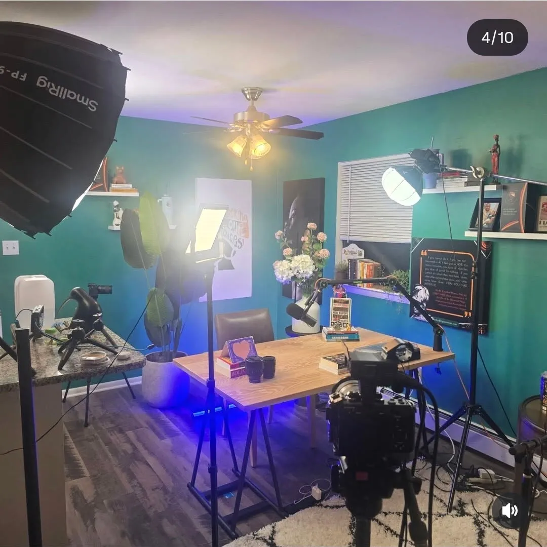 SJC studio production setup with lights, camera, and podcast table